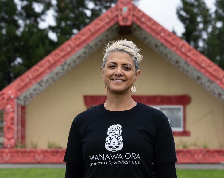 A portrait photo of rongoā Māori practitioner Jolie Davis smiling. 